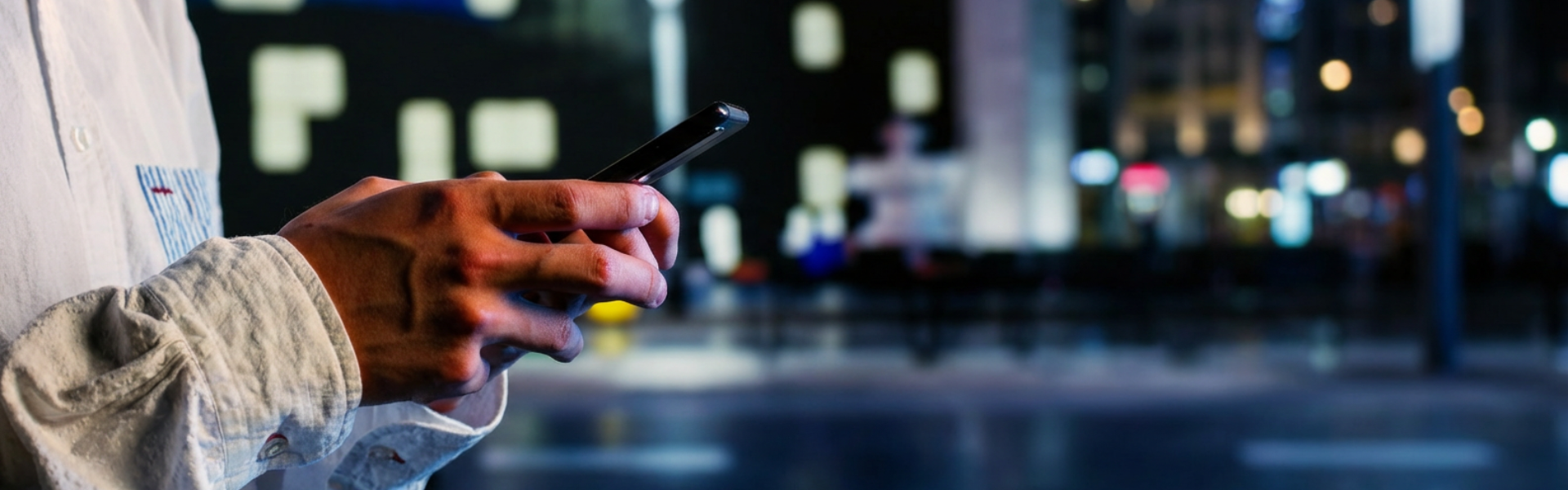 hands holding cell phone