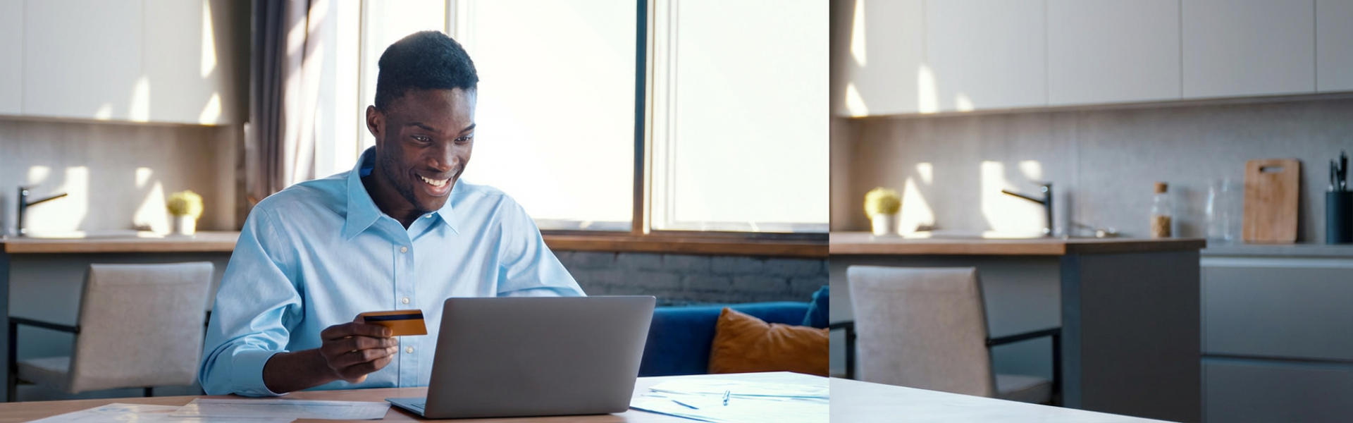 person using laptop holding credit card
